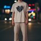 J/bronw Shadows Tee — Sand — worn by a model, front view
