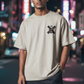 J/bronw Saltire Tee — Sand — worn by a model, front view