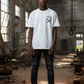 J/bronw Wrenches Tee — White — worn by a model, front view